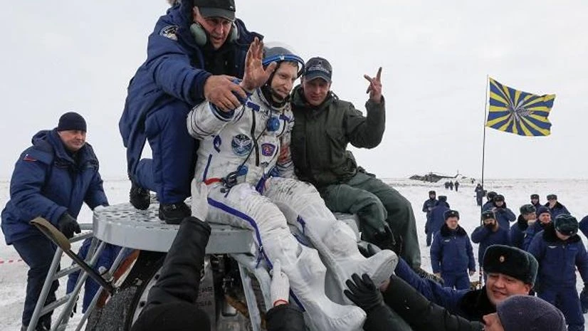 Astronauts The space station crew landing on the snow-covered steppes in Kazakhstan (Photo: Reuters)