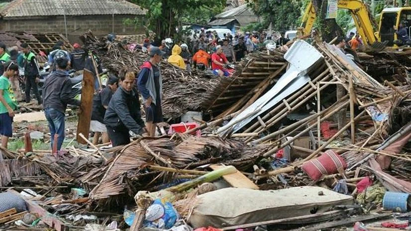 indonesia tsunami Residents inspect a house damaged by a tsunami, in Carita, Indonesia, on Sunday | Photo: PTI