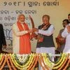 Prime Minister Narendra Modi being presented a memento by BJP workers during a party rally 'Swabhiman Samabesh' near Khurda, Odisha