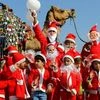 Children dressed as Santa Claus take part in Christmas celebration at a school in Ajmer