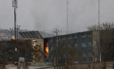 At least 43 dead in suicide attack on Kabul govt building: Health ministry Flames rise from a government building after an explosion and attack by gunmen, in Kabul | AP/PTI