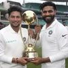 File photo: India's Kuldeep Yadav, left, and Ravindra Jadeja hold the Border-Gavaskar Trophy