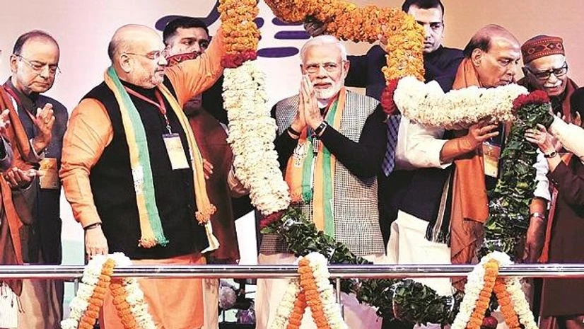 Amit Shah, Narendra Modi, BJP Prime Minister Narendra Modi with party leaders at the BJP National Executive meet in New Delhi on Friday. On the occasion, the party unveiled its 2019 poll slogan of abki baar phir Modi sarkar (Photo: Dalip Kumar)