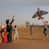 People fly kites on the eve of Makar Sakranti festival, in Mumbai People fly kites on the eve of Makar Sakranti festival, in Mumbai