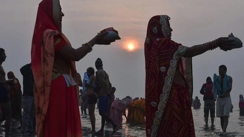 Pilgrims offer prayers as sun rises ahead of 'Makar Sakranti' festival' during Ganga Sagar mela Pilgrims offer prayers as sun rises ahead of 'Makar Sakranti' festival' during Ganga Sagar mela