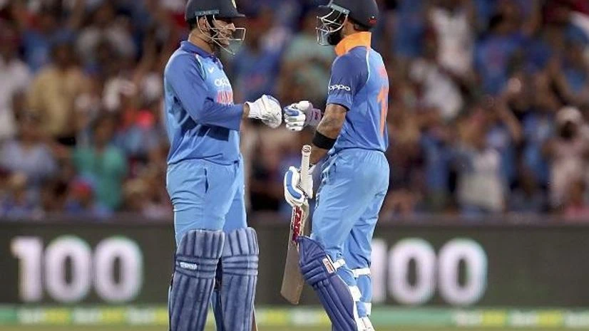 dhoni, kohli India's Virhat Kohli celebrates his 100 against Australia with teammate M.S. Dhoni during their one day international cricket match in Adelaide, Australia, Tuesday | Photo: PTI