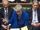 Britain's Prime Minister Theresa May speaks during a debate before a no-confidence vote on Theresa May raised by opposition Labour Party leader Jeremy Corbyn, in the House of Commons, London, Wednesday Jan. 16, 2019. Brexit