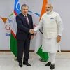 Prime Minister Narendra Modi shakes hands with President of Uzbekistan Shavkat Mirziyoyev on the sidelines of 'Vibrant Gujarat', in Gandhinagar