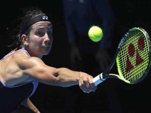 Latvia's Anastasija Sevastova makes a backhand return to Japan's Naomi Osaka Latvia's Anastasija Sevastova makes a backhand return to Japan's Naomi Osaka