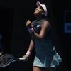 Japan's Naomi Osaka celebrates after defeating Latvia's Anastasija Sevastova during their fourth round match at the Australian Open