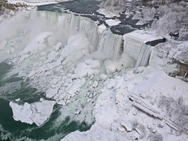 Water flows around ice in subzero temperatures Water flows around ice in subzero temperatures