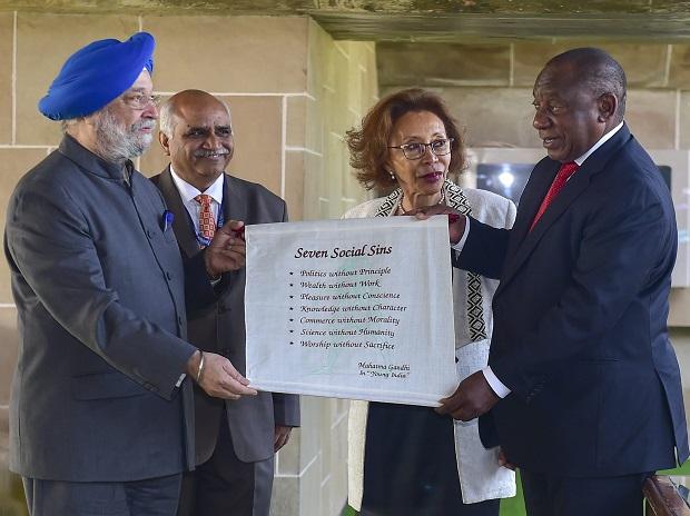 Ramaphosa being presented with a scroll bearing Gandhian views on social sins by Housing and Urban Affairs Minister Hardeep Singh Puri Ramaphosa being presented with a scroll bearing Gandhian views on social sins by Housing and Urban Affairs Minister Hardeep Singh Puri