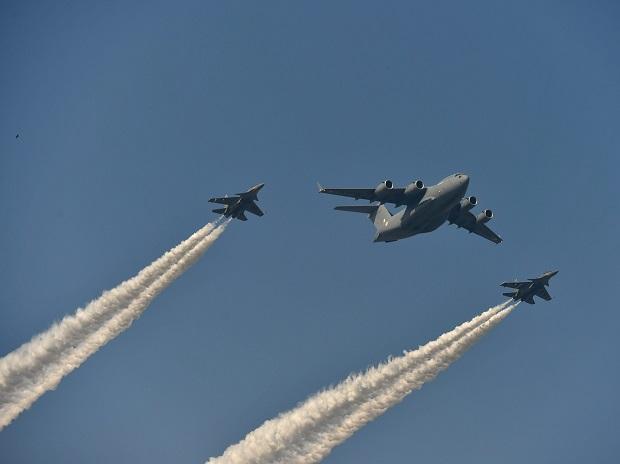 Indian Air Force's two SU- 30 MKIs escort C-17 Globemaster aircraft in Globe Formation Indian Air Force's two SU- 30 MKIs escort C-17 Globemaster aircraft in Globe Formation
