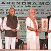 PM Narendra Modi being felicitated by Tamil Nadu CM K Palaniswami at the foundation stone laying ceremony of AIIMS in Madurai