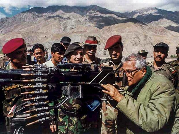 The Former Defence minister takes a view through a heavy machine gun, seized from the Pakistan army in Kargil in 2001 The Former Defence minister takes a view through a heavy machine gun, seized from the Pakistan army in Kargil in 2001