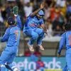 India's MS Dhoni, left, and Ambati Rayudu celebrate the wicket of New Zealand's James Neesham during their fifth one day international at Westpac Stadium in Wellington