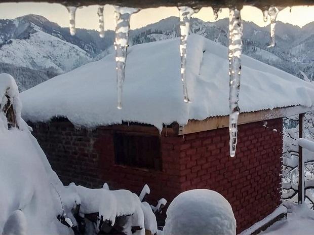 Icicles hang from the roof of a ceiling on a cold winter day after heavy snowfall, in Mandi Icicles hang from the roof of a ceiling on a cold winter day after heavy snowfall, in Mandi
