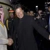 Pakistani Prime Minister Imran Khan, centre, greets Saudi Arabia's Crown Prince Mohammed bin Salman, left, upon his arrival at Nur Khan airbase in Rawalpindi, Pakistan, Sunday (Photo: PTI)