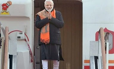 PM Modi visits National Cemetary in Seoul, pays homage to Korean martyrs Prime Minister Narendra Modi gestures upon his arrival at the airport in Seoul | Photo: PTI