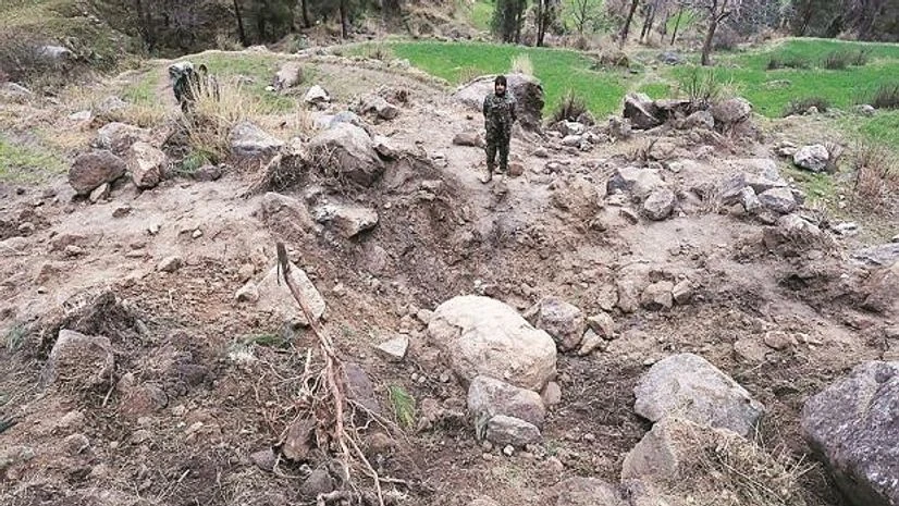 Pakistan’s army soldier stands at the edge of a crater, after IAF fighter jets struck on February 26, according to Pakistani officials, in Jaba village, near Balakot, Pakistan Photo: Reuters Pakistan’s army soldier stands at the edge of a crater, after IAF fighter jets struck on February 26, according to Pakistani officials, in Jaba village, near Balakot, Pakistan Photo: Reuters