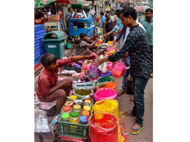 A vendor sells different colours of Gulal at a roadside shop in Guwahati A vendor sells different colours of Gulal at a roadside shop in Guwahati