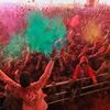 Devotees play with 'gulal' on the occasion of Holi festival celebrations at Govind Dev Ji temple, in Jaipur