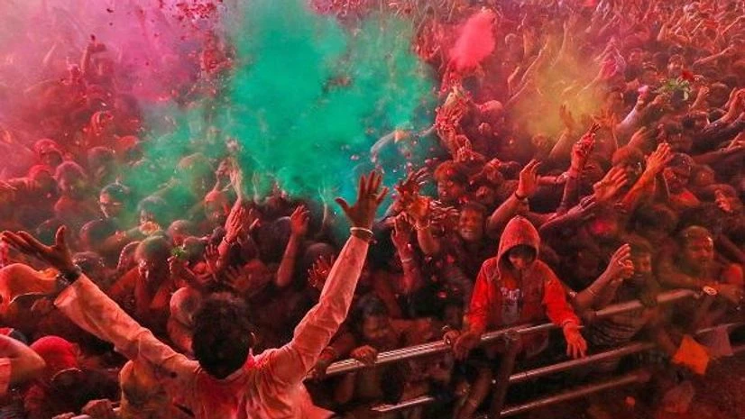 Devotees play with 'gulal' on the occasion of Holi festival celebrations at Govind Dev Ji temple, in Jaipur Devotees play with 'gulal' on the occasion of Holi festival celebrations at Govind Dev Ji temple, in Jaipur