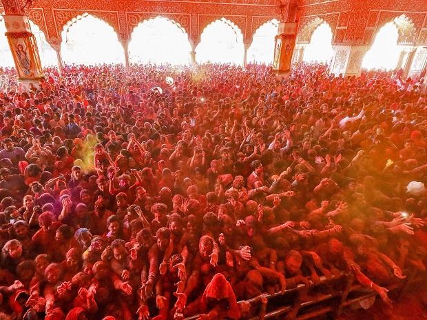 Devotees play with gulal on the occasion of Holi festival celebrations at Govind Dev Ji temple in Jaipur Devotees play with gulal on the occasion of Holi festival celebrations at Govind Dev Ji temple in Jaipur