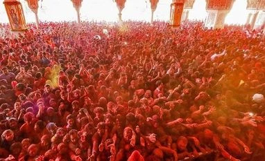 Coronavirus outbreak may take the colour out of Holi celebrations Devotees play with 'gulal' on the occasion of Holi festival celebrations at Govind Dev Ji temple, in Jaipur