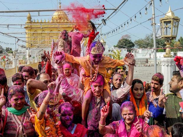 People smear colours at each other during Holi celebrations at Durgiana Temple in Amritsar People smear colours at each other during Holi celebrations at Durgiana Temple in Amritsar