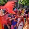 Students of University of Calcutta play with 'Gulal' during 'Holi' celebrations at their campus, in Kolkata