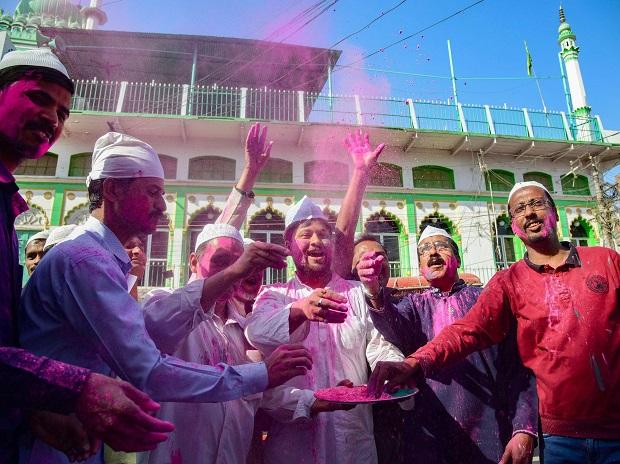 Members of Muslim and Hindu communities celebrate Holi festival in front of Jama Masjid in Prayagraj Members of Muslim and Hindu communities celebrate Holi festival in front of Jama Masjid in Prayagraj