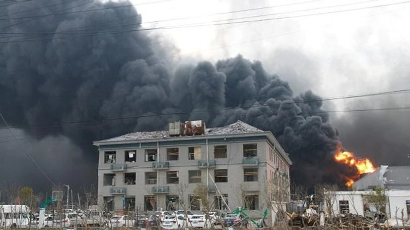 China chemical plant explosion Smoke billows from fire behind a damaged building following an explosion at the pesticide plant owned by Tianjiayi Chemical, in Xiangshui county, China March 21, 2019. Photo: Reuters