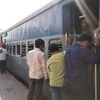 Passengers try to board the unreserved compartment at Buxar station