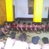 Students gather around for their mid day meal at the primary school in Jayapur