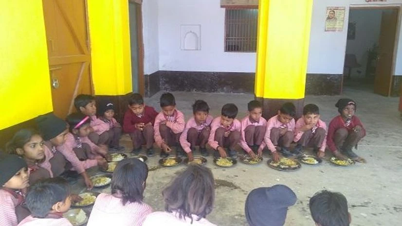 Students gather around for their mid day meal at the primary school in Jayapur Students gather around for their mid day meal at the primary school in Jayapur