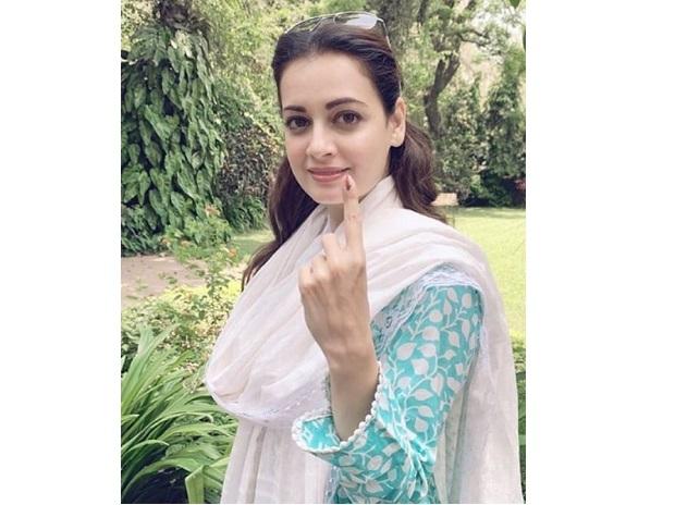 Dia Mirza shows her ink-marked finger after casting vote Dia Mirza shows her ink-marked finger after casting vote