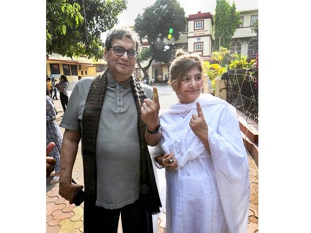 Filmmaker Subhash Ghai and his wife Mukta Ghai show their inked marked finger Filmmaker Subhash Ghai and his wife Mukta Ghai show their inked marked finger
