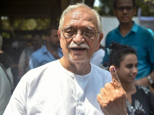 Lyricist and film director Gulzar shows his ink-marked finger after casting vote Lyricist and film director Gulzar shows his ink-marked finger after casting vote