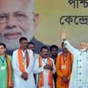 Prime Minister Narendra Modi waves at supporters during an election campaign rally for the Lok Sabha polls, at Haldia in East Midnapore district of West Bengal