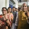 Union Minister and BJP candidate from Lucknow, Rajnath Singh, and his wife Savitri Singh show their finger marked with indelible ink after casting vote
