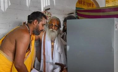 Ram temple trust chief tests Covid-19 positive; CM calls Medanta team Ram Janma Bhoomi Nyas Samiti's Mahant Nritya Gopal Das comes out after casting his vote at a polling station