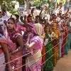People wait in a queue to cast their vote during the sixth phase of Lok Sabha elections, in Sultanpur | Photo: PTI