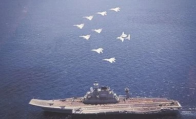 Navy Chief reviews combat readiness, makes an address from INS Vikramaditya French Rafales and Indian Navy MIG 29 flying past INS Vikramaditya during the joint exercises