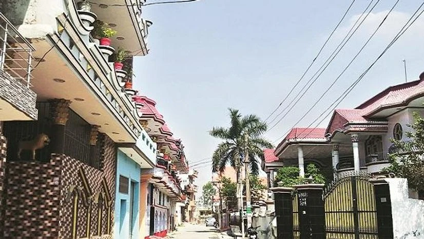 A mansion-lined street in the village of Awam where almost every family has a member settled abroad A mansion-lined street in the village of Awam where almost every family has a member settled abroad