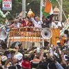 Congress General Secretary Priyanka Gandhi Vadra along with the party candidate Ajay Rai and Chhattisgarh CM Bhupesh Singh Baghel waves at the supporters during a roadshow for the Lok Sabha polls, in Varanasi Wednesday
