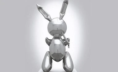 Jeff Koons work sells for $91.1 million, record for living artist "Rabbit", a stainless steel casting of an inflatable rabbit, overtook the previous record set by British painter David Hockney's "Portrait of an Artist"