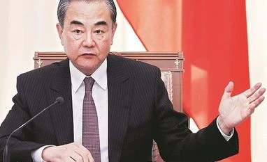 China urges US to not go too far in 'damaging moves' against our interests China's top diplomat Wang Yi