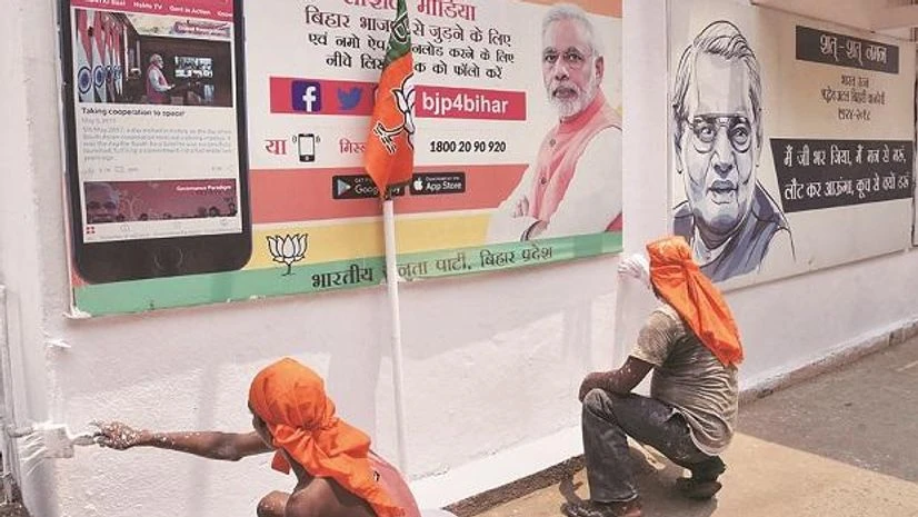 Workers whitewash the BJP state office on the eve of counting day of the Lok Sabha elections, in Patna on Wednesday | Photo: PTI Workers whitewash the BJP state office on the eve of counting day of the Lok Sabha elections, in Patna on Wednesday | Photo: PTI
