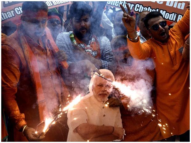 Riding on a massive Modi wave sweeping through most parts of India, the BJP is set to return to power as it led in 292 seats Riding on a massive Modi wave sweeping through most parts of India, the BJP is set to return to power as it led in 292 seats